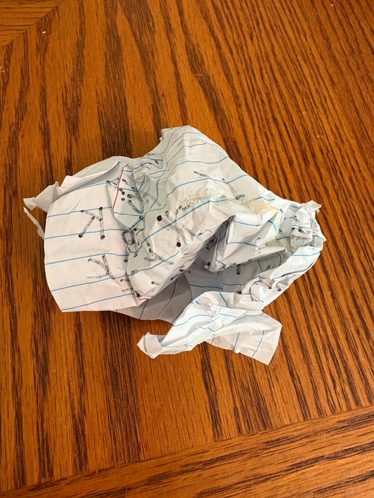 Balled up piece of paper with secret notes on the inside....